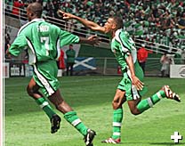 Oliseh celebrating the thunderbolt against Spain