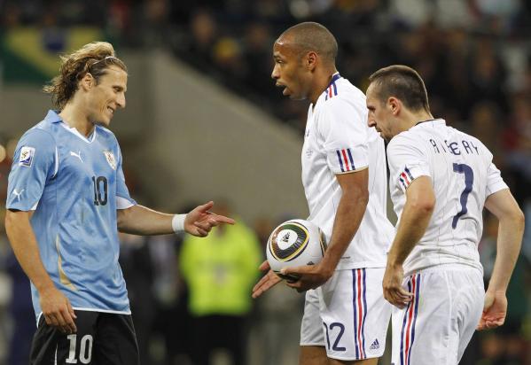 Pardon their French? Think not...Forlan contends with Henry, Ribery